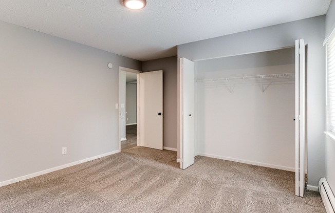 Bedroom, Window, & Closet | White Pines Apartments | Shakopee MN