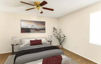 A bedroom with a bed, a ceiling fan, and a painting on the wall.