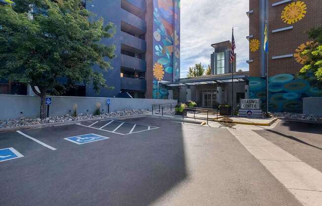 A parking lot with a sign that says "LEASING CENTER".