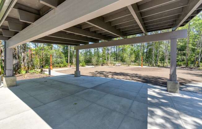 Outside Rest Area with Concrete Floor and Structure for Shade, Soil and Trees