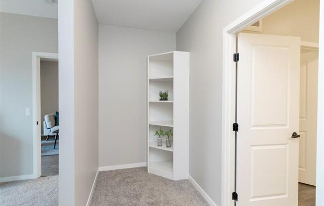 Den of home office nook with white bookshelf