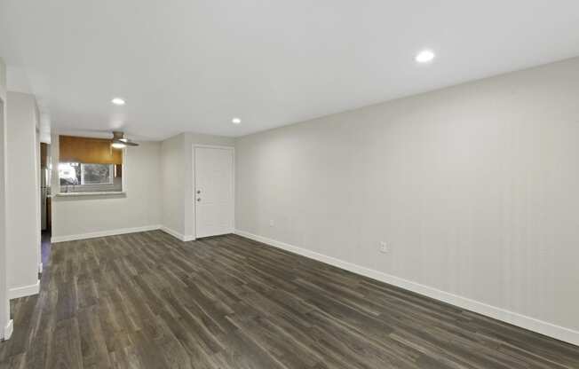 Oversized Living Room with Hardwood Floors and White Walls at Park 210 Apartment Homes, Edmonds, 98026