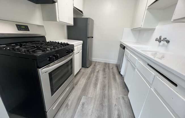 Kitchen with Stainless Steel Appliances and White Cabinets