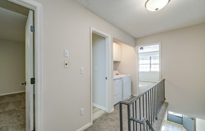 Second floor hallway and railing in townhome platinum interior at The Arbor in Blue Springs, MO