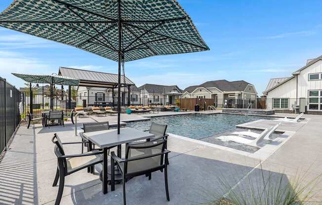 Resort-style pool and lounging at Avilla Oakridge in Forney, TX.