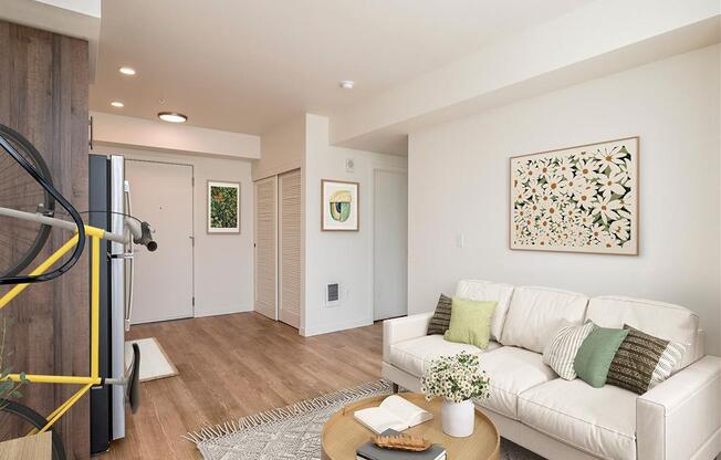 a living room with a couch and a table and a yellow bike