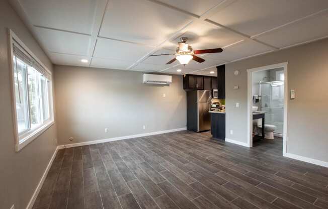 view of living room towards the kitchen and bathroom