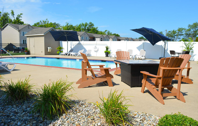 Outdoor pool and fire pit with seating for four