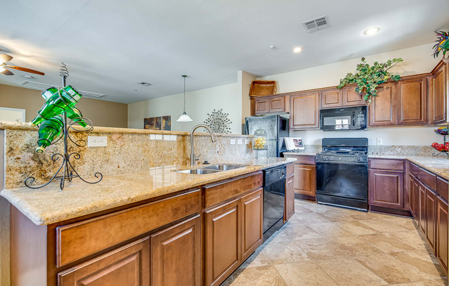 a large kitchen with wooden cabinets and a sink