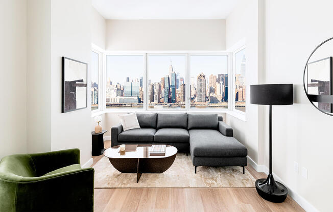 Modern Long Island City 2 bedroom apartment living room with wood flooring and contemporary furnitur