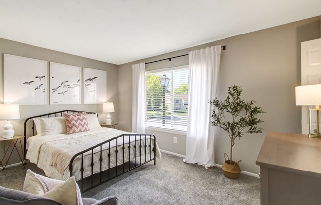 Bedroom with cozy bed at The Fountains at Deerwood Apartments, Jacksonville, FL, 32256