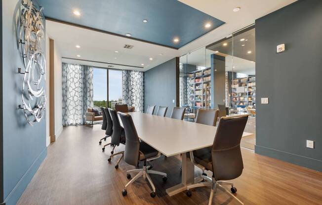 a conference room with a long table and chairs