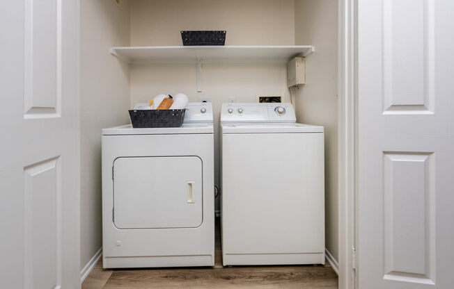 a washer and dryer in a small laundry room