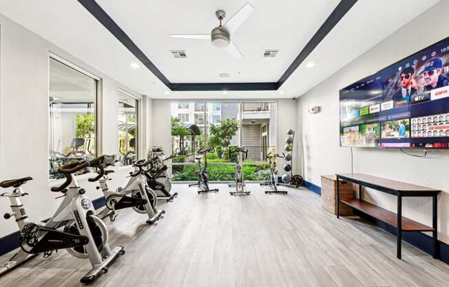 Spin cycle studio with immersive lighting and sound system at Harlow River Oaks apartments in Houston, TX