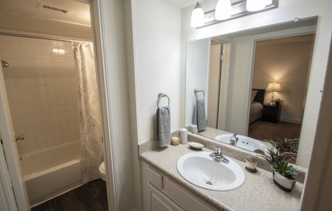This is a photo of the bathroom in the 653 square foot 1 bedroom apartment at Princeton Court Apartments in Dallas, TX.
