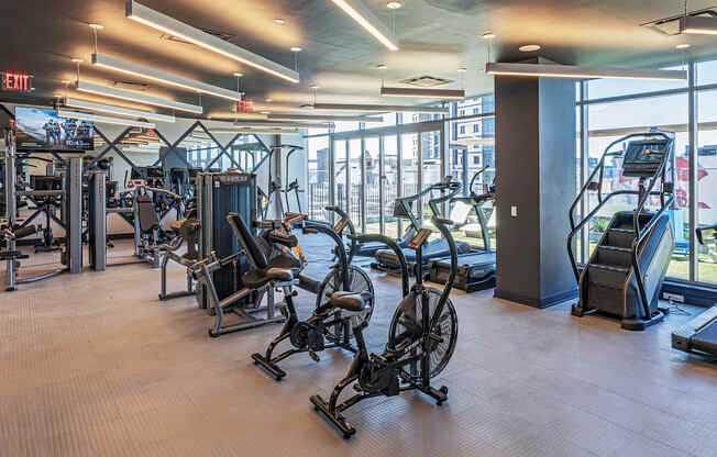 3thirty3 new rochelle ny apartment high rise photo of large fitness center with cardio and strength training equipment such as exercise bicycles and weight machines