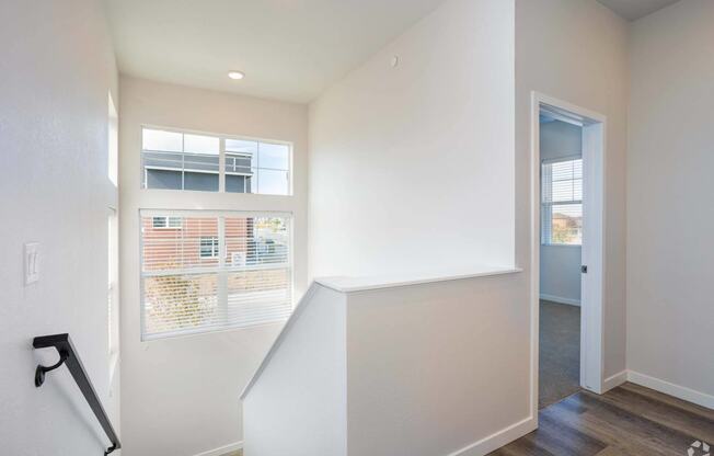 staircase looking down with window at Palisade Park Townhomes, Broomfield, 80023