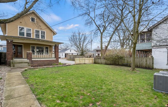 Single-family historic home in West Central with porch and private courtyard.