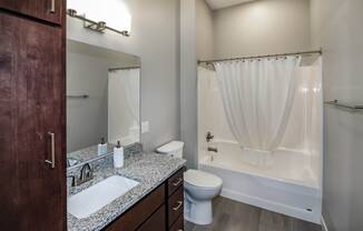 a bathroom with a toilet sink and bathtub