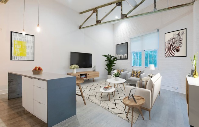 a living room with a kitchen and a dining room