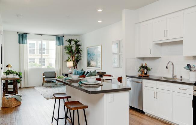 a living room filled with furniture and a large window