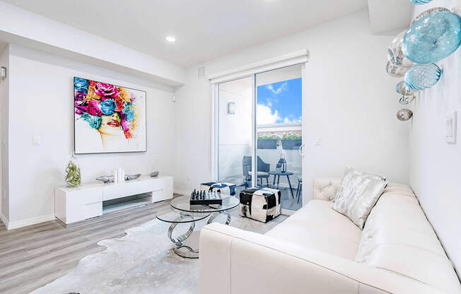 Living room with Private Balcony in the right, wood style flooring, recessed lighting