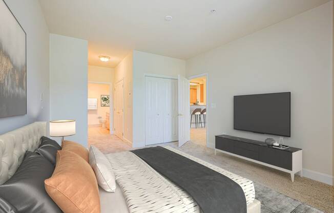 a bedroom with a large bed and a tv