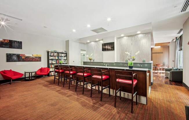 A room with a long table and chairs.