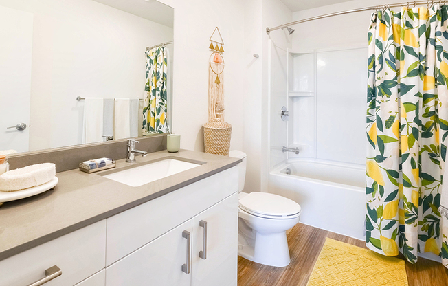 Bathroom with built in shower shelving and ample storage