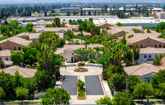 A view of a residential area with houses and trees.