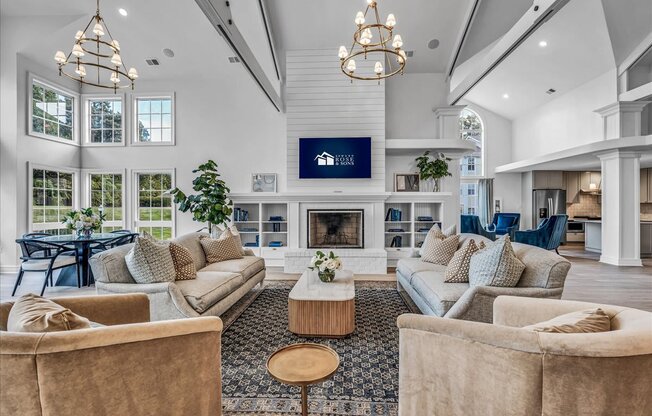 a living room with couches and chairs and a fireplace