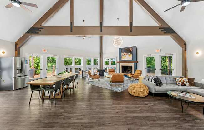 A spacious living room with wooden floors and furniture.