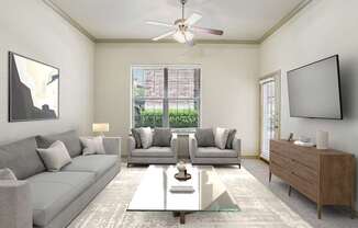 A modern living room with a grey sofa, a coffee table, and a flat-screen TV mounted on the wall.