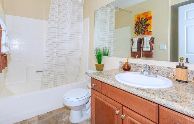 a kitchen with a sink and a mirror