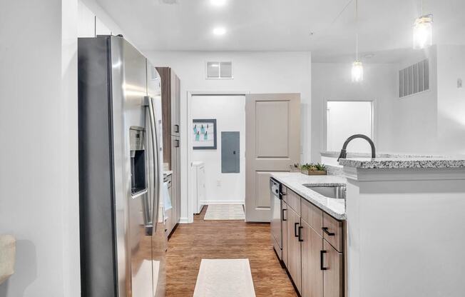 a kitchen with a counter top and a refrigerator