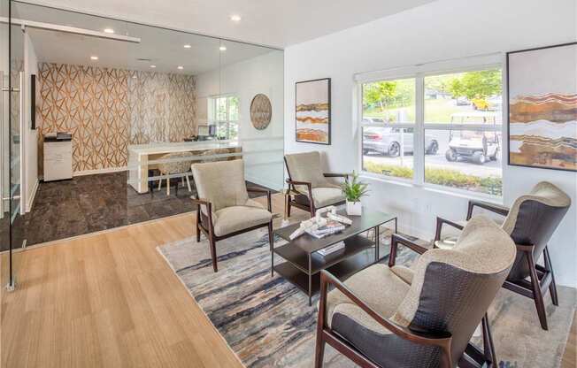 A living room with a glass table and chairs.