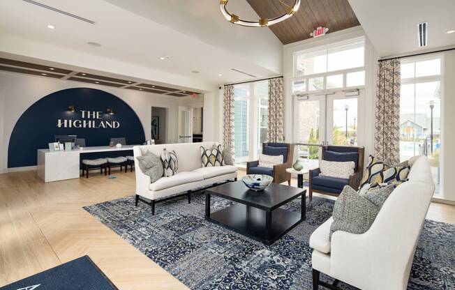 The Highland leasing office interior along with sofas and seating