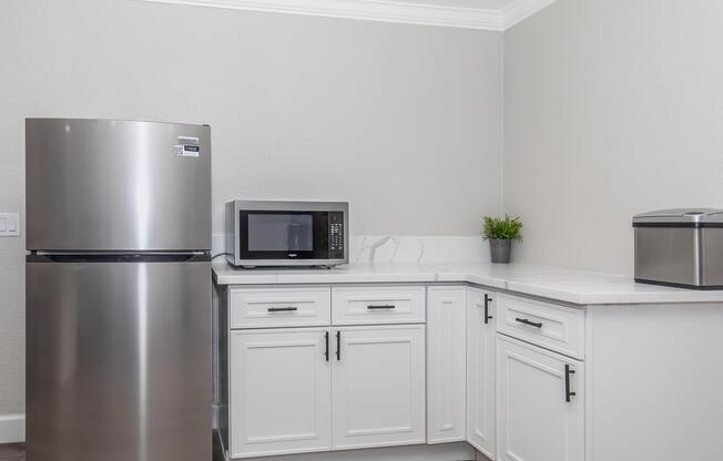 a stainless steel refrigerator in a kitchen