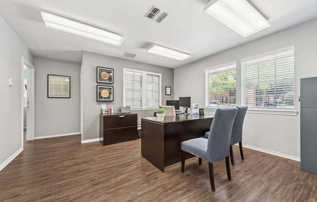 A room with a desk and a chair.