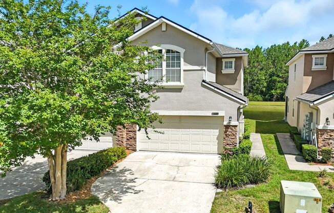 Immaculate three-bedroom, three-bath end-unit townhome showcasing upgrades throughout.