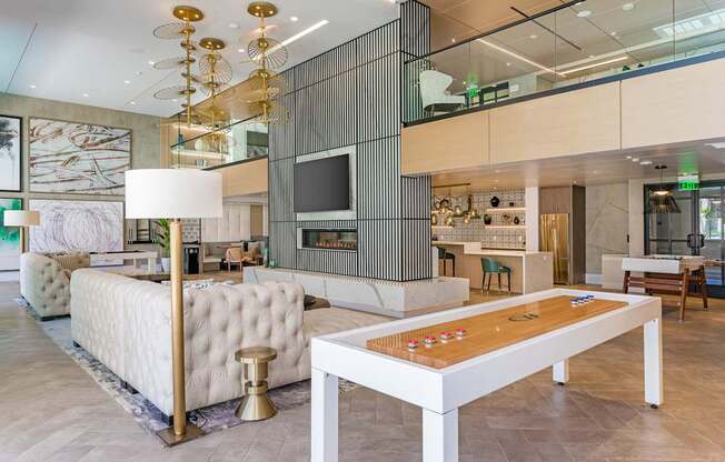 a living room filled with furniture and a table with a board game