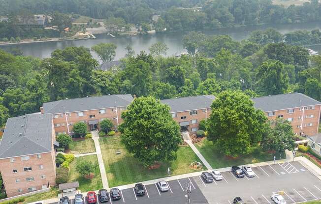 an aerial view of a parking lot in front of a building