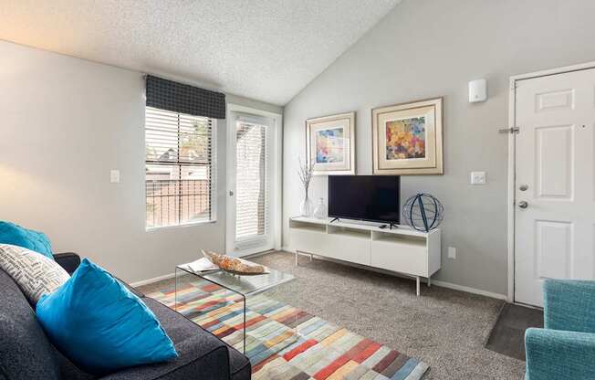 a living room with a couch and a tv