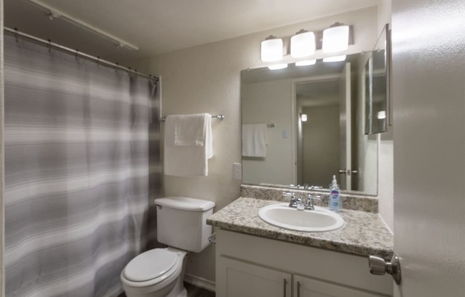 This is a photo of the bathroom in the 970 square foot 2 bedroom, 2 bath apartment at Preston Park Apartments in Dallas, TX