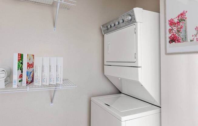 A white oven and dishwasher in a kitchen.