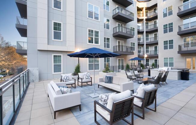 An elevated courtyard lounge at Modera Liberty Row offers comfortable seating and a polished outdoor retreat surrounded by modern apartment homes in Charlotte.