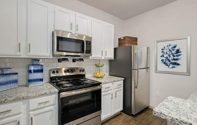 View of kitchen with appliances at Sandstone Creek Apartments , Overland Park, KS