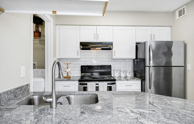 Kitchen with granite counter tops and stainless steel appliances