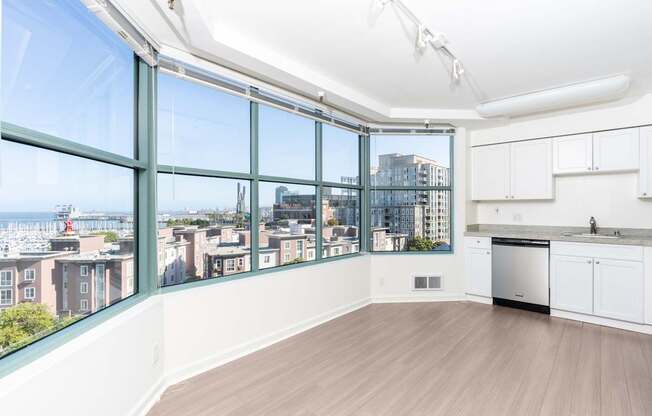 A kitchen with a view of the city.