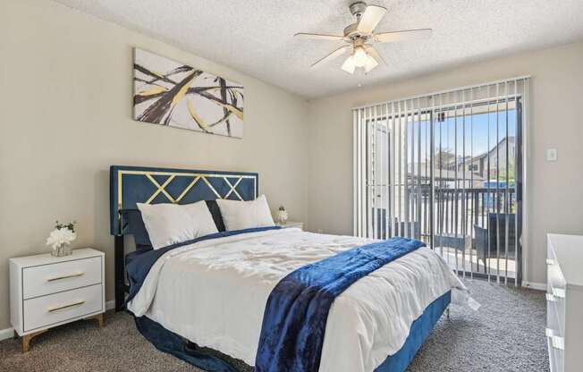 a bedroom with a bed and a ceiling fan at The Glen at Highpoint, Dallas, 75243